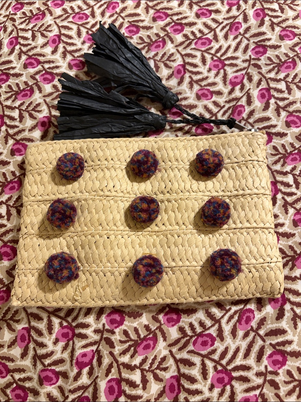 Beige Woven Clutch with Multicolor Pom Accents and Black Tassel